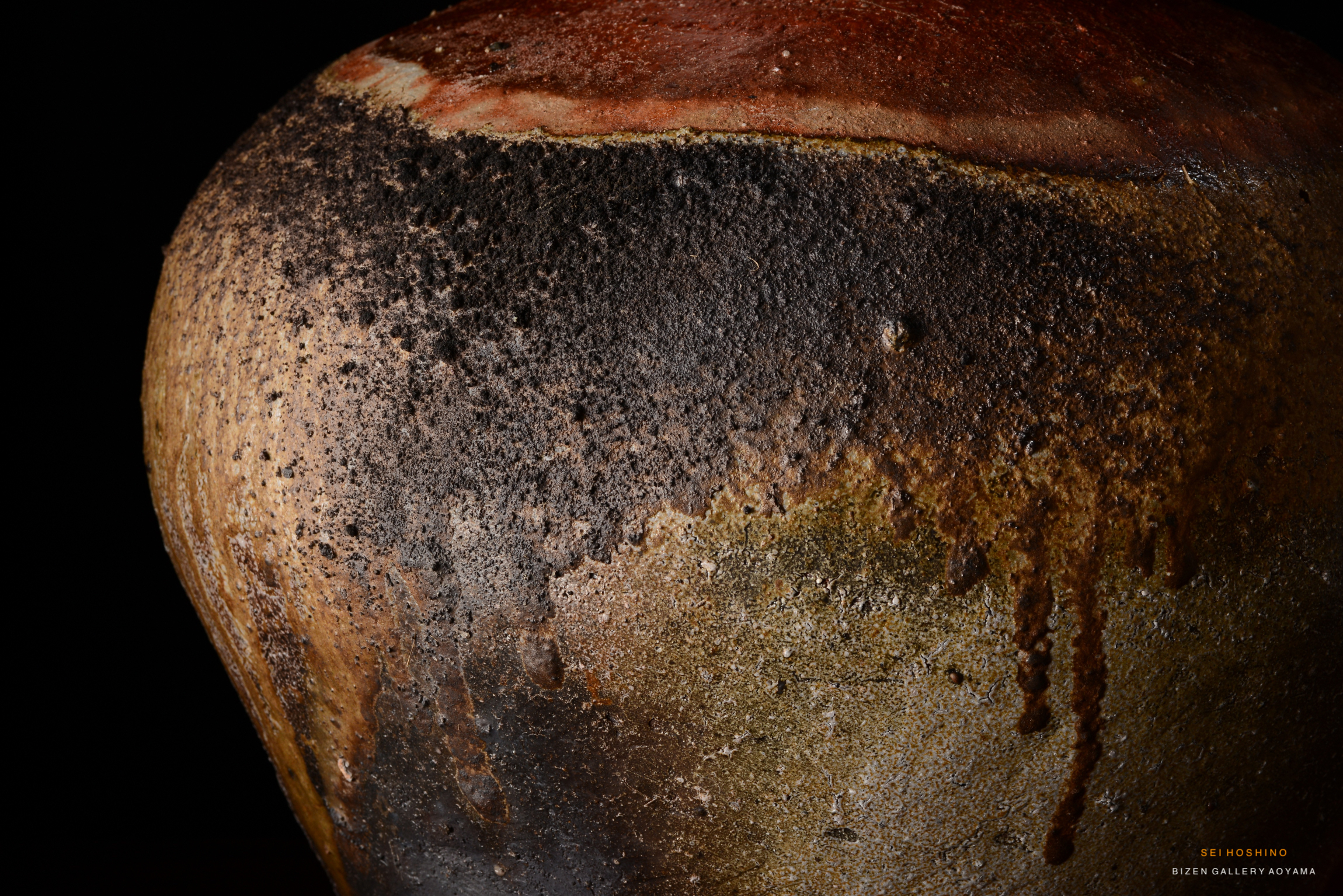 Close-up of a Bizen pottery piece showcasing its textured surface and natural glaze effects.