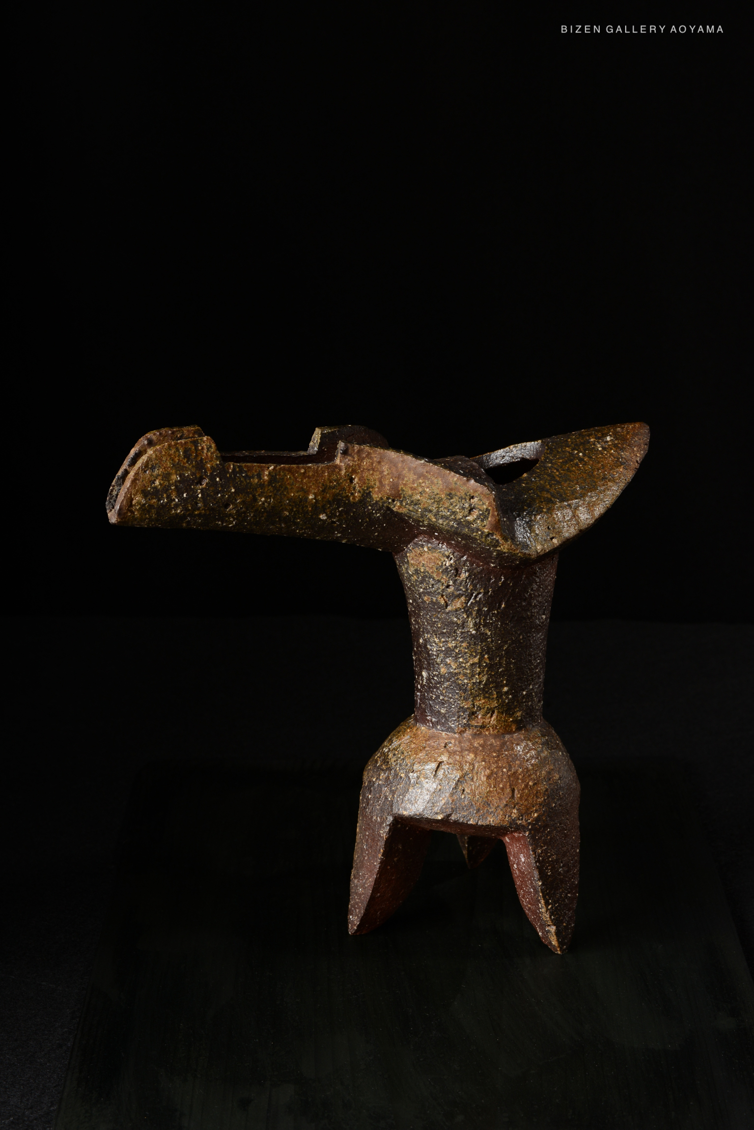 A Bizen pottery Hanaire Shaku, a traditional Japanese flower vase, featuring a unique design with a textured, earthy finish.