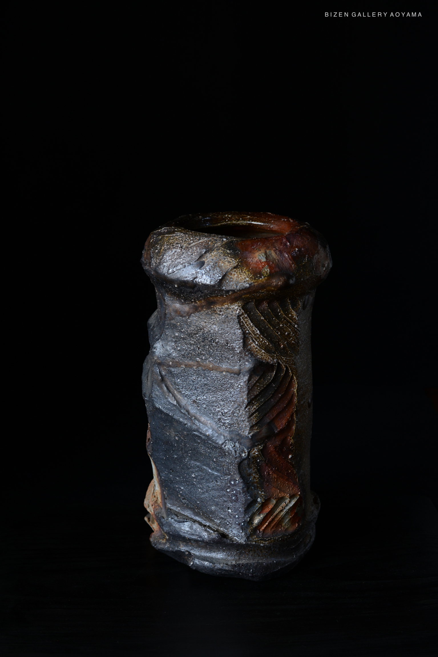 Ceramic artwork by Kenji Matsushima, showcasing unique textures and colors, displayed against a black background.