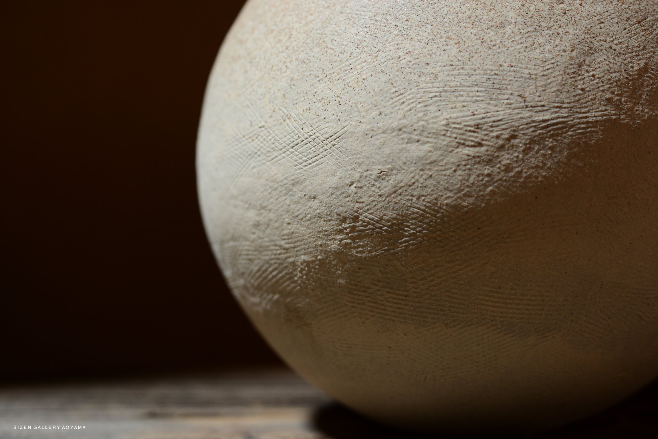 Close-up view of a Bizen pottery piece showcasing its textured surface and natural finish.