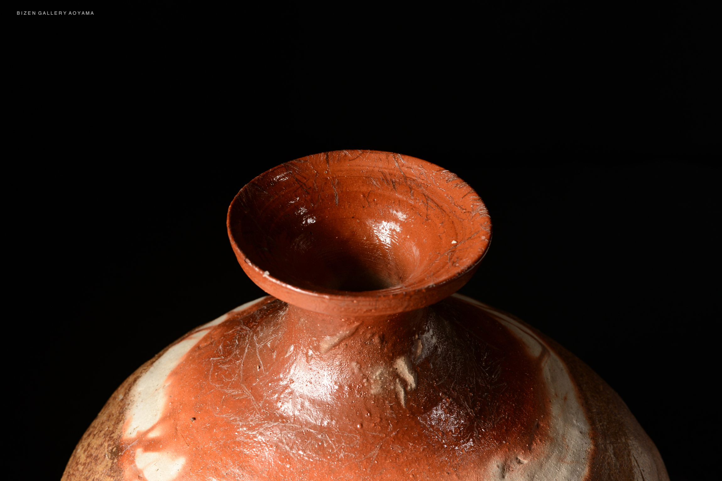 Close-up view of the mouth of a Bizen O Kabura Tokkuri, showing its unique clay texture and glaze.