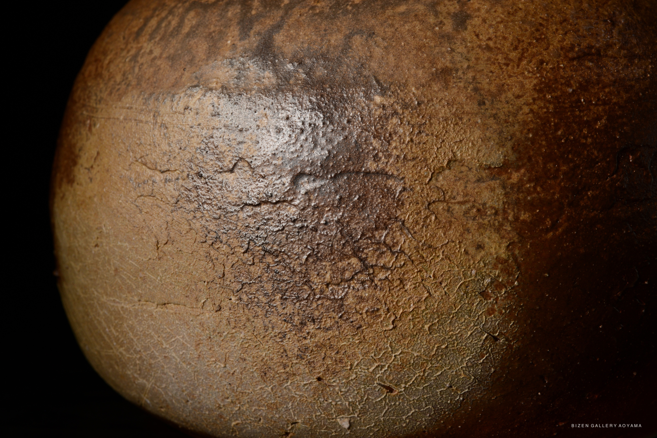 Close-up of a Bizen O Kabura Tokkuri showing its textured surface and natural glaze patterns.